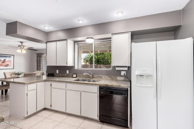 kitchen featuring dishwasher, white refrigerator with ice dispenser, a sink, white cabinetry, and a peninsula