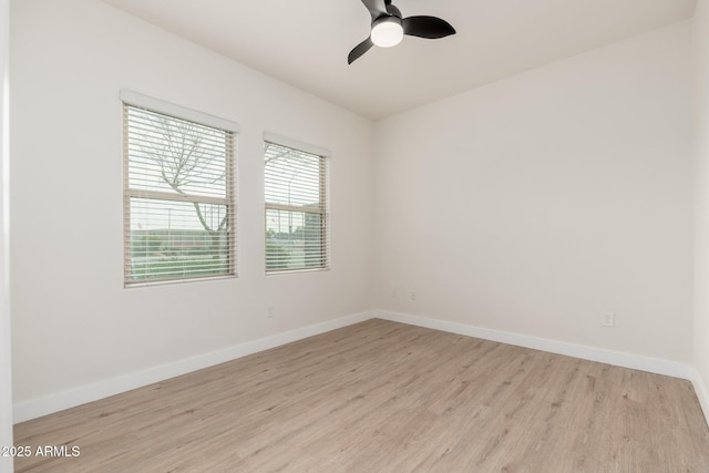 empty room featuring ceiling fan and light wood-type flooring