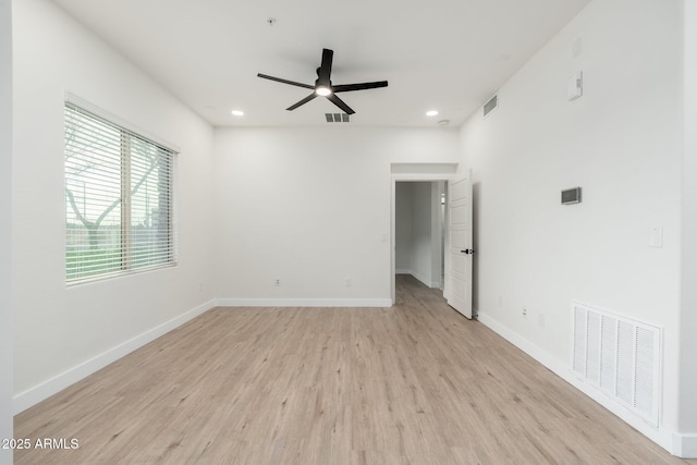 unfurnished room with ceiling fan and light hardwood / wood-style floors