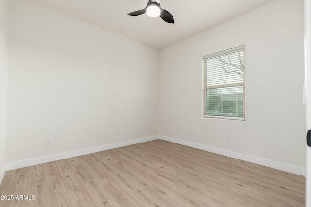 empty room featuring ceiling fan and light hardwood / wood-style floors