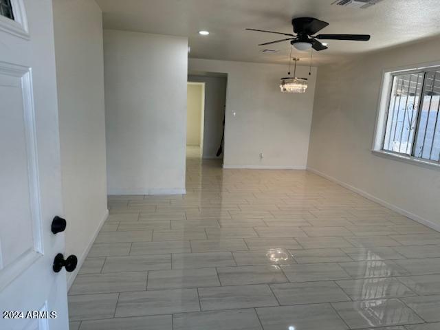 empty room featuring ceiling fan