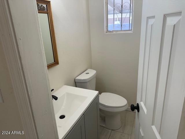 bathroom featuring vanity and toilet