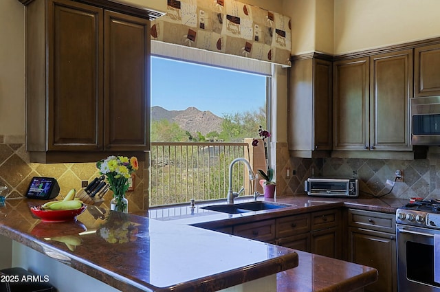 32516 N 68th Pl, Scottsdale, AZ 85266 - kitchen with appliances with stainless steel finishes, a sink, a mountain view, and tasteful backsplash