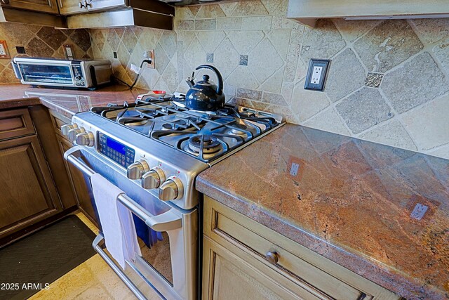 32516 N 68th Pl, Scottsdale, AZ 85266 - kitchen with stainless steel range, tasteful backsplash, and tile counters