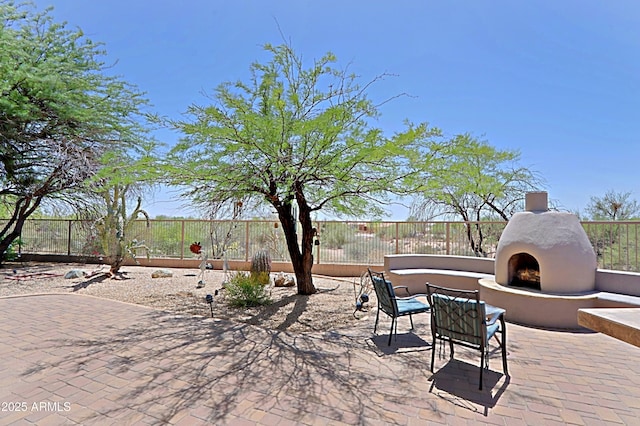 32516 N 68th Pl, Scottsdale, AZ 85266 - fenced backyard featuring exterior fireplace and a patio area