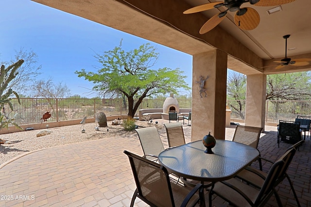 32516 N 68th Pl, Scottsdale, AZ 85266 - fenced backyard with exterior fireplace, ceiling fan, a patio, and outdoor dining space