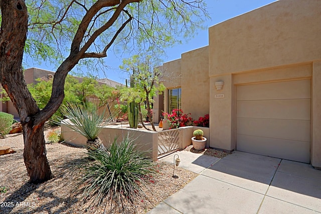 32516 N 68th Pl, Scottsdale, AZ 85266 - view of front of property featuring stucco siding, an attached garage, and driveway