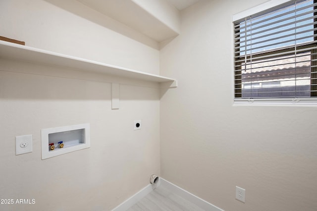 clothes washing area featuring washer hookup and hookup for an electric dryer