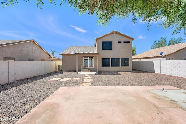 rear view of house featuring a patio