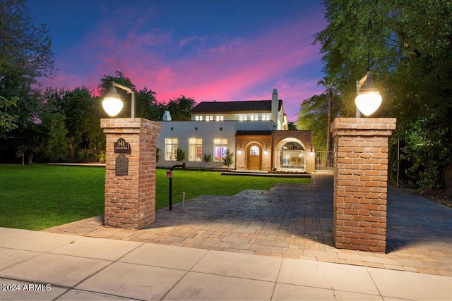 mediterranean / spanish-style house featuring a lawn