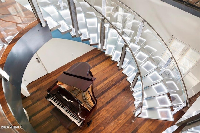 stairway featuring wood-type flooring