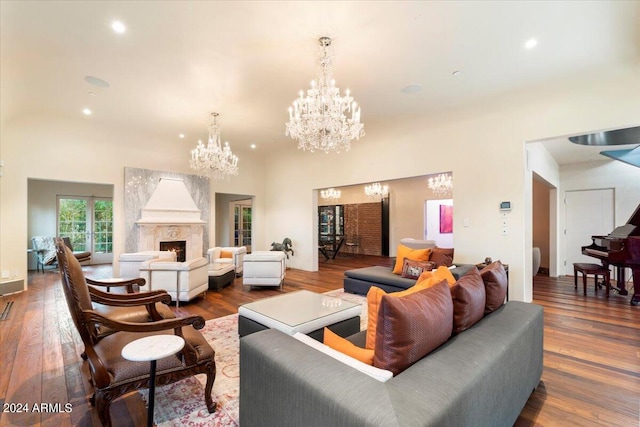 living room with wood-type flooring and a high end fireplace