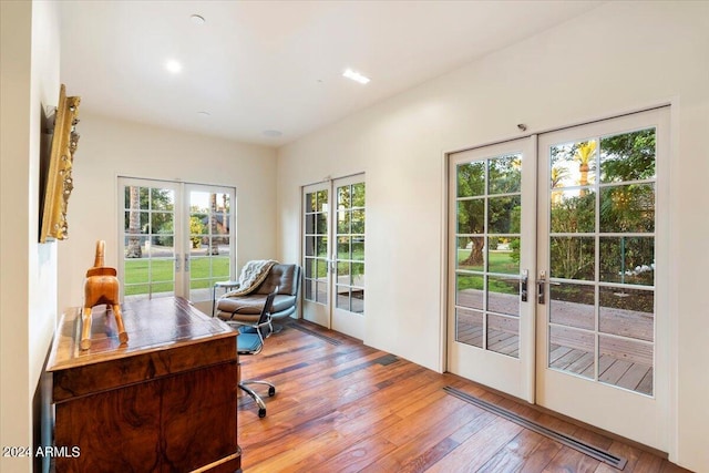 office area featuring light wood-type flooring, french doors, and a wealth of natural light