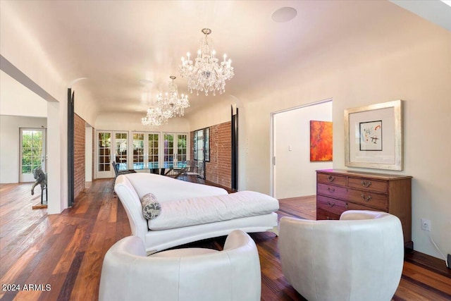 living room featuring a chandelier, french doors, and dark hardwood / wood-style flooring