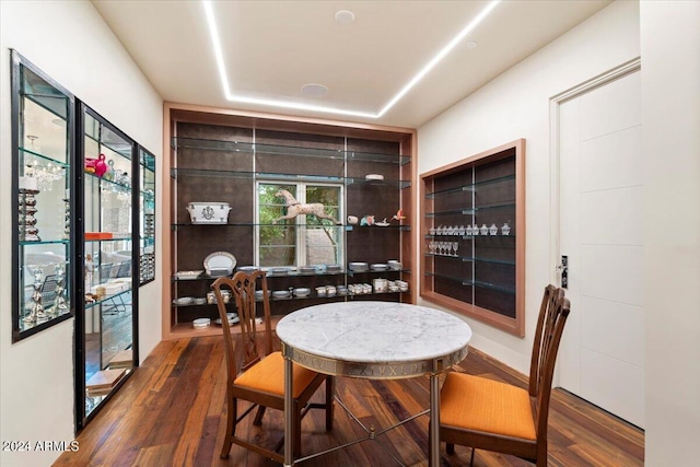 dining area with dark hardwood / wood-style floors