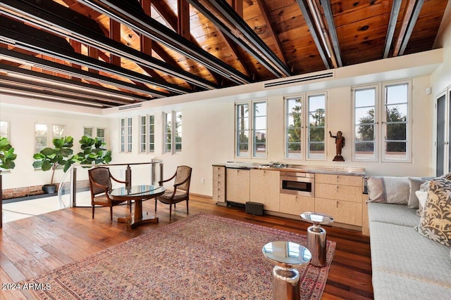 living room with wood ceiling, dark wood-type flooring, and a wealth of natural light