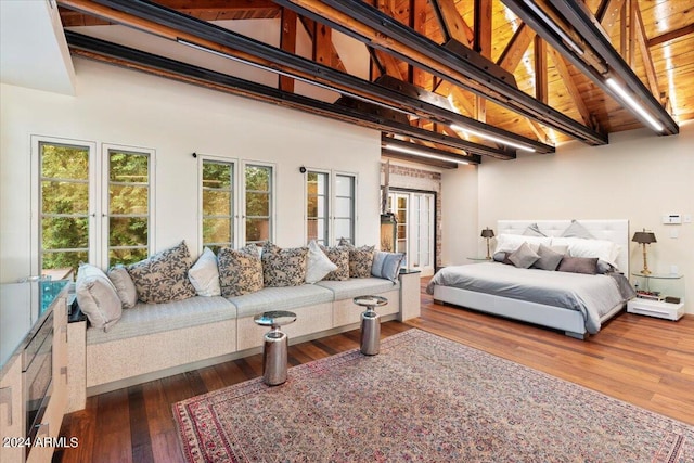 bedroom with dark hardwood / wood-style floors, beam ceiling, high vaulted ceiling, and wooden ceiling