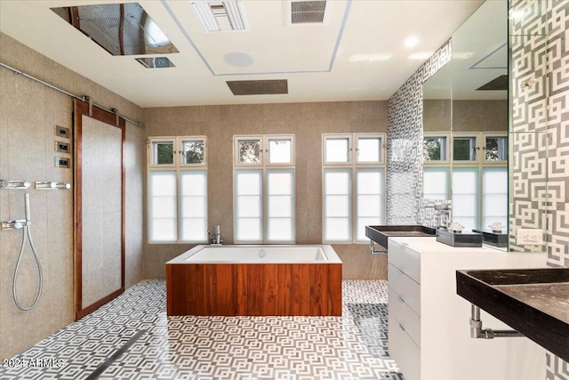 bathroom featuring independent shower and bath and tile walls