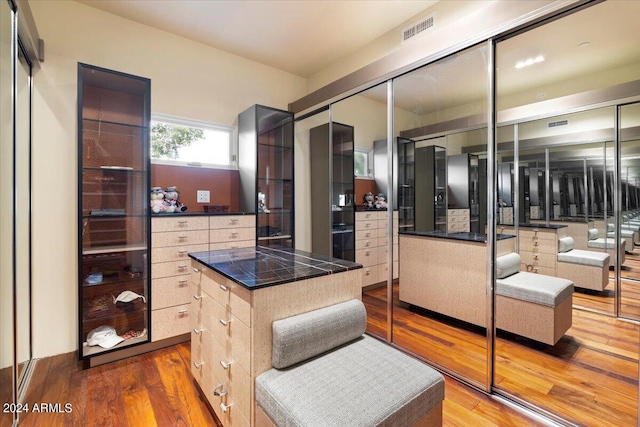 kitchen with a kitchen island and hardwood / wood-style flooring