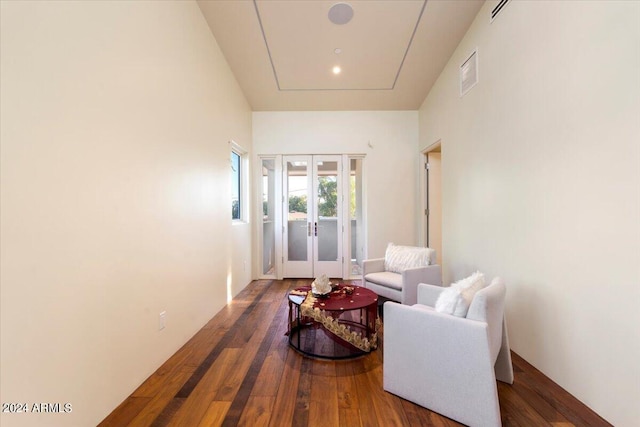 living area featuring french doors and dark hardwood / wood-style floors