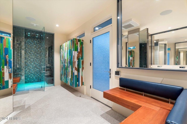 bathroom with a shower with shower door