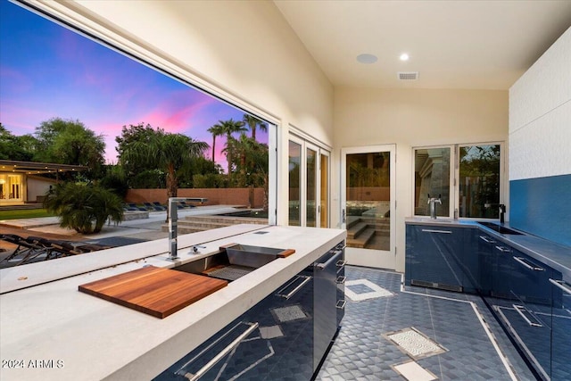 patio terrace at dusk featuring sink