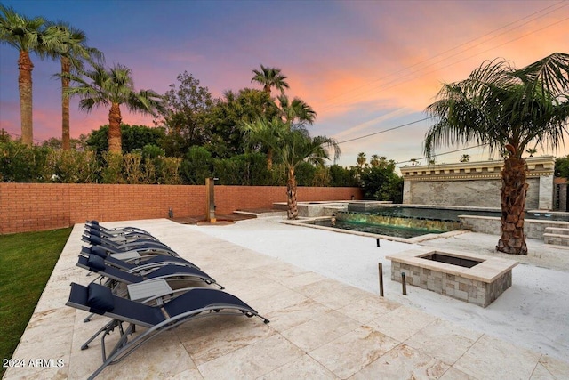 view of patio terrace at dusk