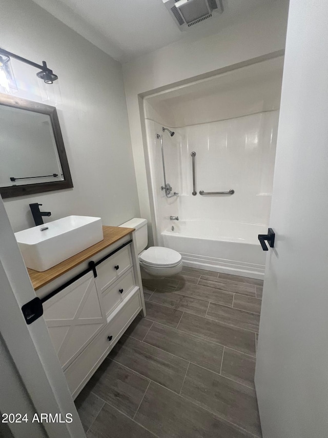 full bathroom featuring vanity, toilet, and bathtub / shower combination