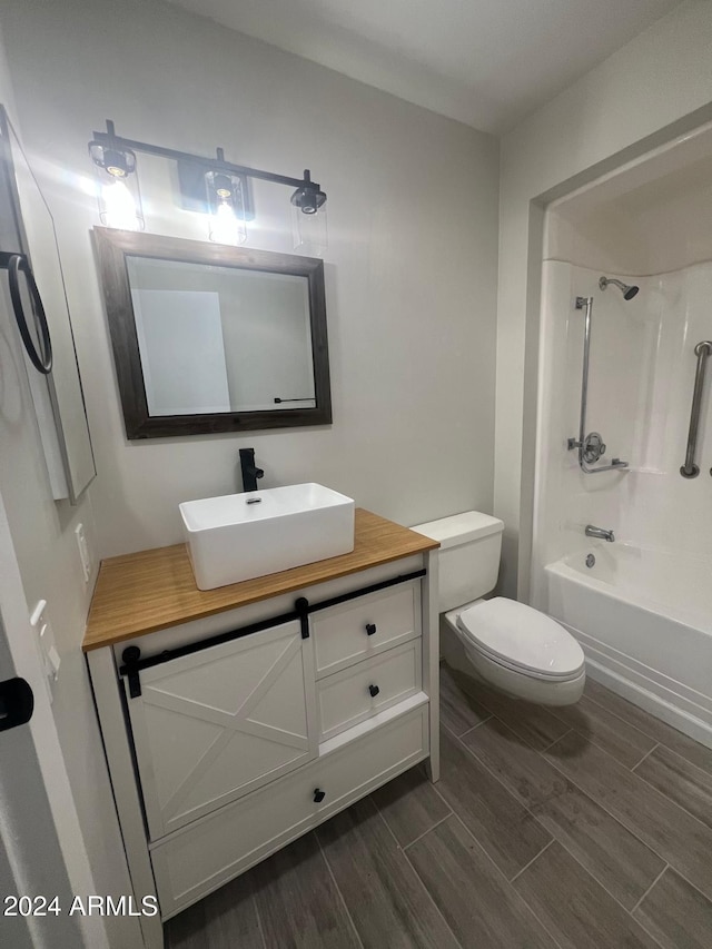 full bathroom featuring vanity, toilet, and tub / shower combination