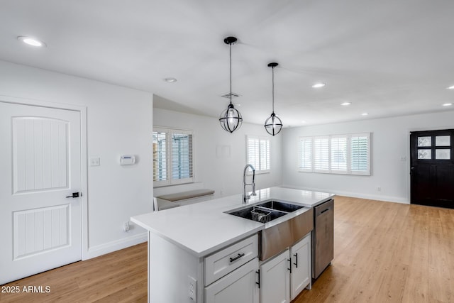2336 E Flower St, Phoenix, AZ 85016 - kitchen featuring a sink, dishwasher, light wood finished floors, recessed lighting, and baseboards