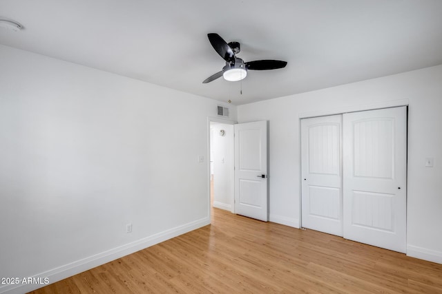 2336 E Flower St, Phoenix, AZ 85016 - unfurnished bedroom featuring light wood-type flooring, baseboards, a closet, and a ceiling fan