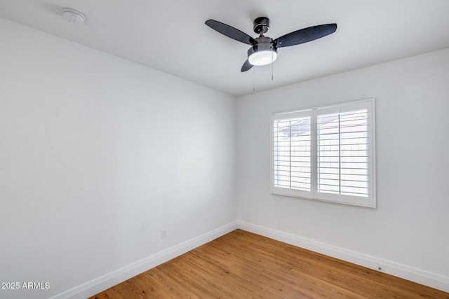 2336 E Flower St, Phoenix, AZ 85016 - unfurnished room featuring baseboards, light wood-style floors, a ceiling fan, and a smoke detector