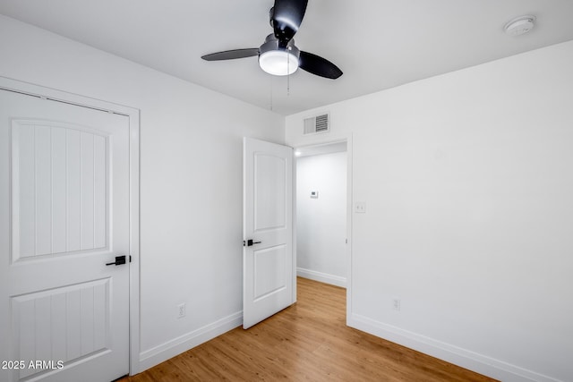 2336 E Flower St, Phoenix, AZ 85016 - unfurnished bedroom with light wood-type flooring, baseboards, and ceiling fan