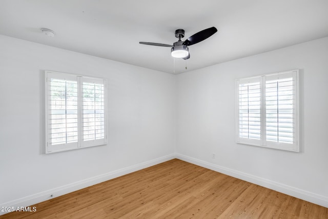 2336 E Flower St, Phoenix, AZ 85016 - empty room featuring baseboards, light wood-style floors, a ceiling fan, and a smoke detector