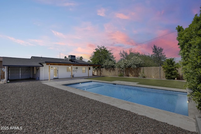2336 E Flower St, Phoenix, AZ 85016 - pool at dusk featuring fence and a patio area