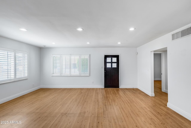 2336 E Flower St, Phoenix, AZ 85016 - foyer entrance with healthy amount of natural light, recessed lighting, light wood finished floors, and baseboards