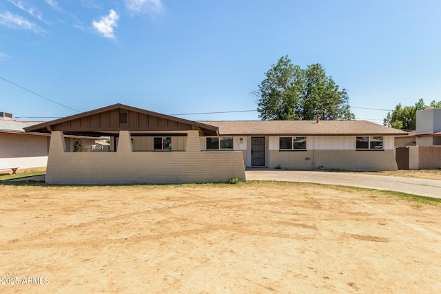 3719 W Griswold Rd, Phoenix, AZ 85051 - view of front of property with brick siding and board and batten siding