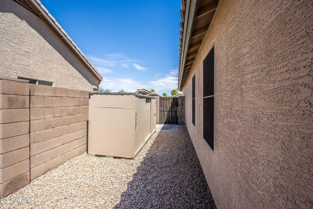 3127 W Folgers Rd, Phoenix, AZ 85027 - view of side of property featuring stucco siding, fence, and a gate
