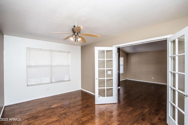 spare room featuring french doors, dark hardwood / wood-style flooring, and ceiling fan