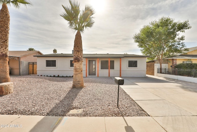 single story home featuring a patio