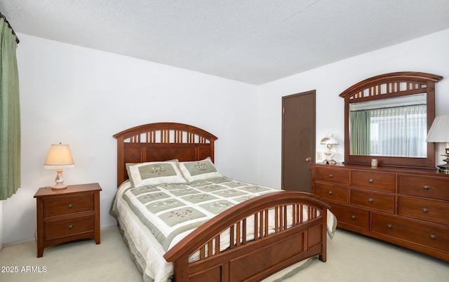 carpeted bedroom with a textured ceiling