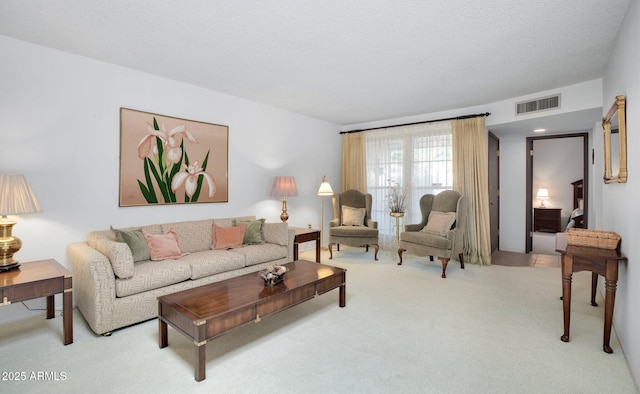 living room with light colored carpet and a textured ceiling