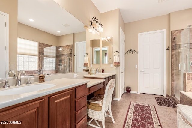 bathroom featuring a shower with shower door, tile patterned floors, and vanity