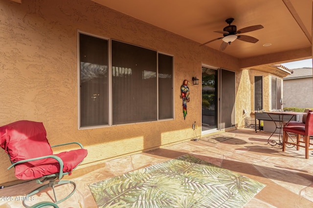 view of patio / terrace featuring ceiling fan