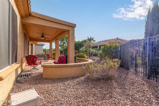 exterior space featuring ceiling fan