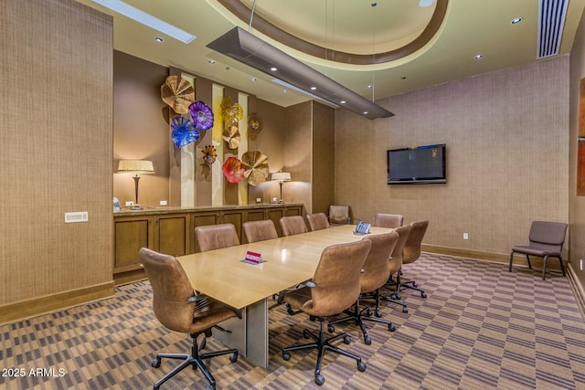 interior space featuring a towering ceiling and a tray ceiling