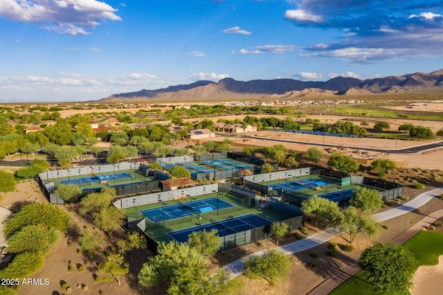 birds eye view of property with a mountain view