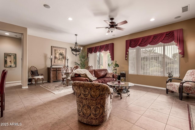 tiled living room featuring ceiling fan