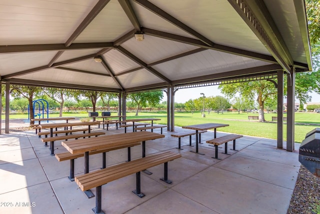 view of community with a playground, a patio area, a gazebo, and a yard