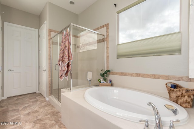 bathroom with a bath and a shower stall